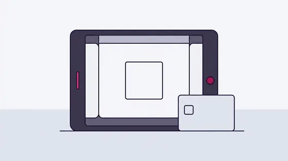 Tablet met een leeg vierkant op het scherm naast een bankpas